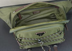 Open green Prada bag showing inner lining and front studded zipper pocket.