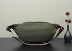 Green Prada bag back view with top handle tabs and zippered back panel.