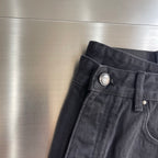 Dark denim pants waistband with metal button and front fly details