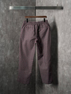 Gucci pants with elastic waistband and tapered legs, maroon/gray GG-pattern fabric