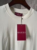 Light cream Gucci T-shirt with red GUCCI tag at the collar