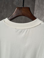 Light cream Gucci T-shirt crew neckline on a wooden hanger