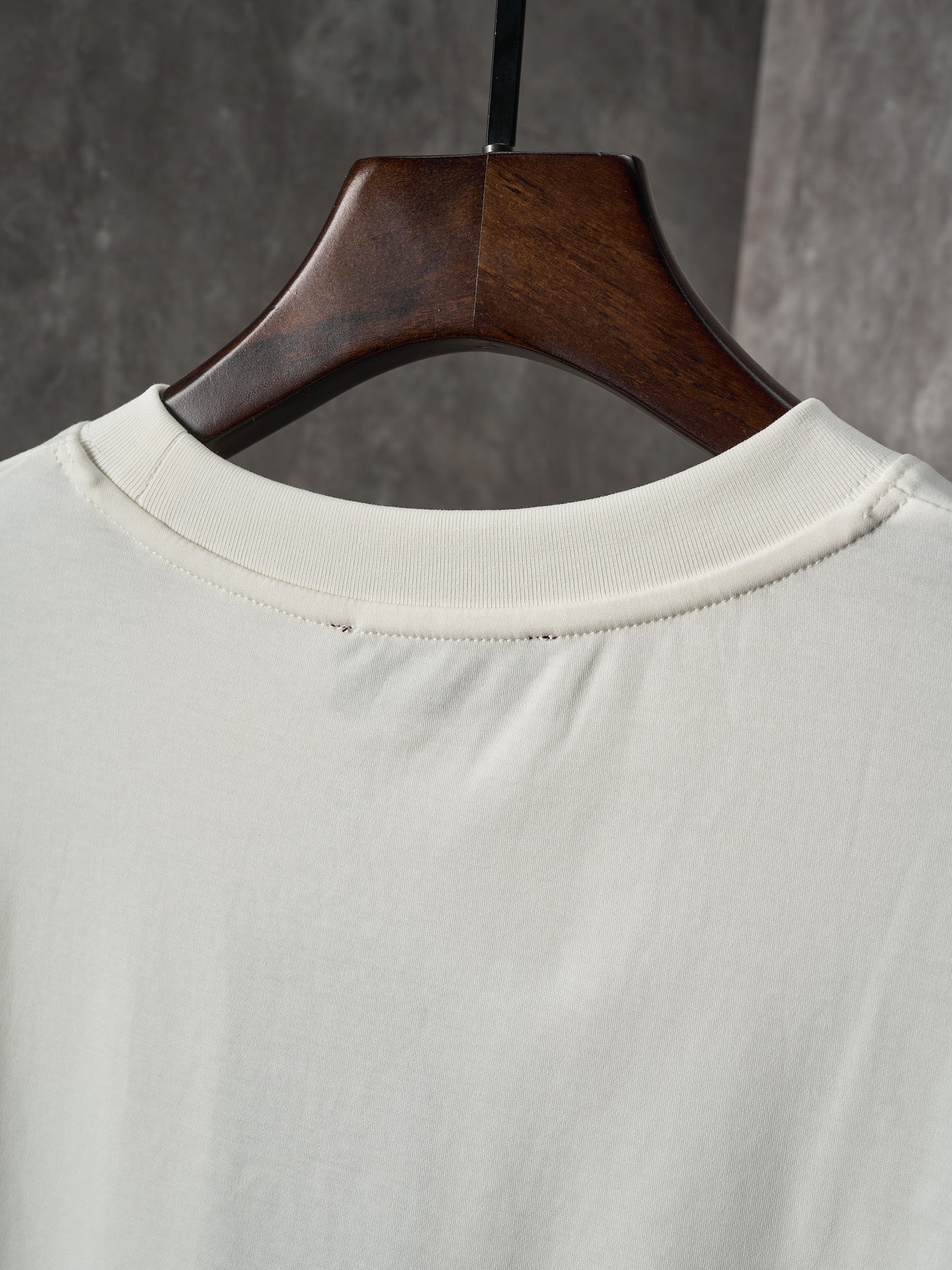 Light cream Gucci T-shirt crew neckline on a wooden hanger