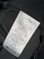 Black Dior jacket care label with material and sizing information