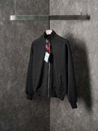 Black Dior zip-up bomber jacket with stand collar and zip front