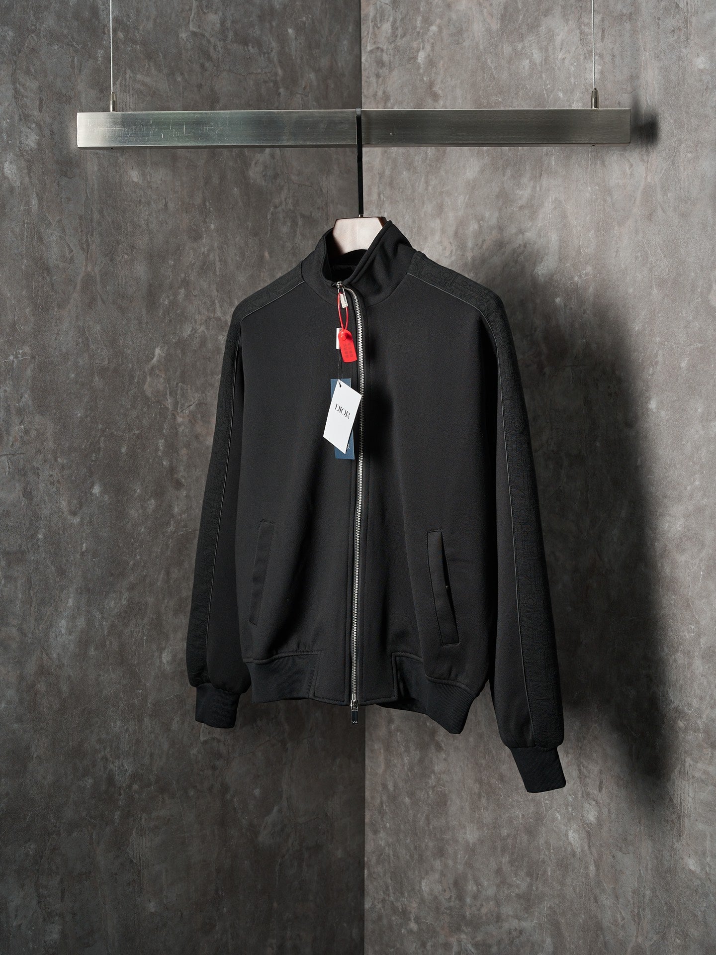 Black Dior zip-up bomber jacket with stand collar and zip front