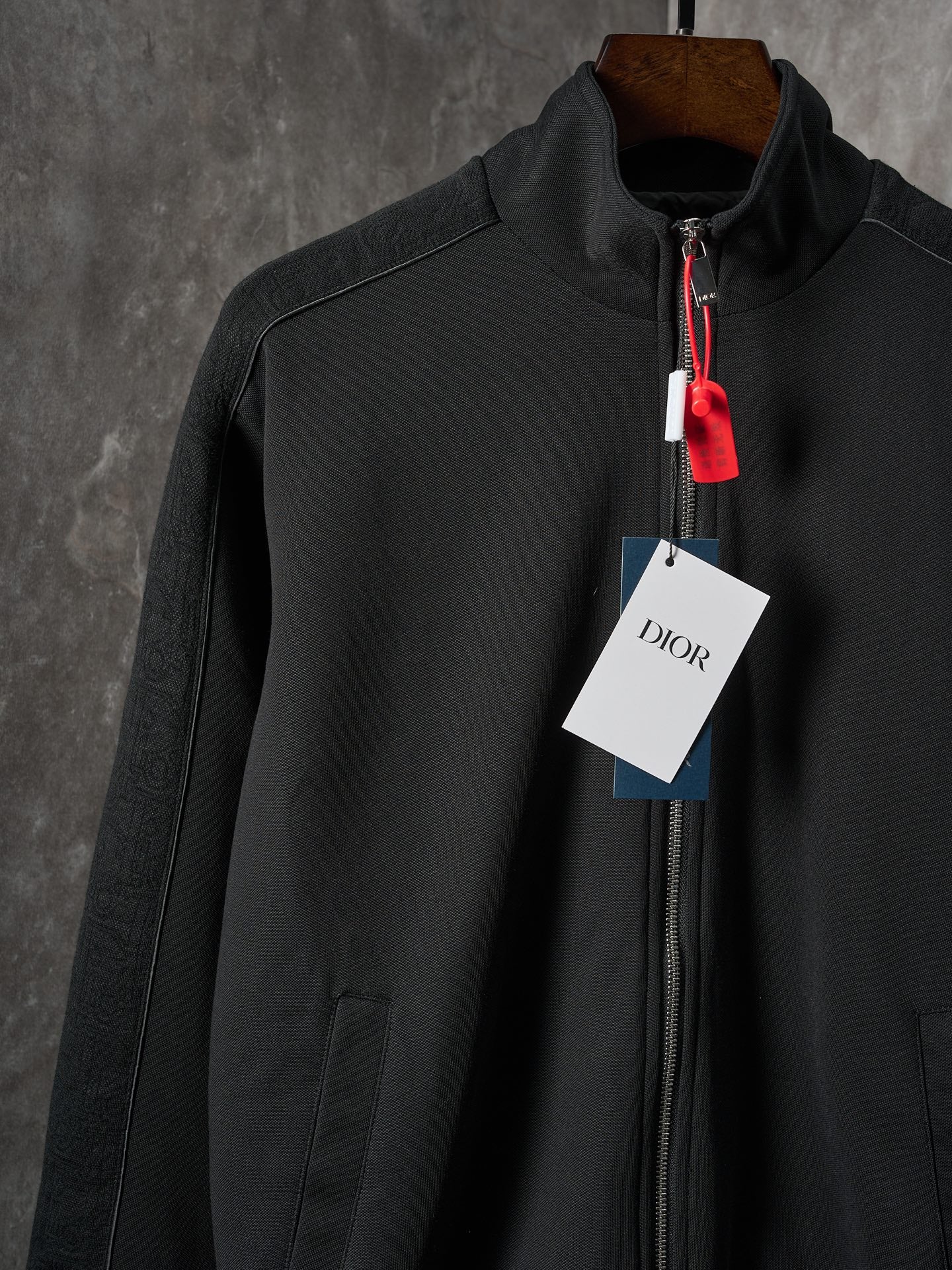 Black Dior zip-up bomber jacket with zip front and ribbed cuffs