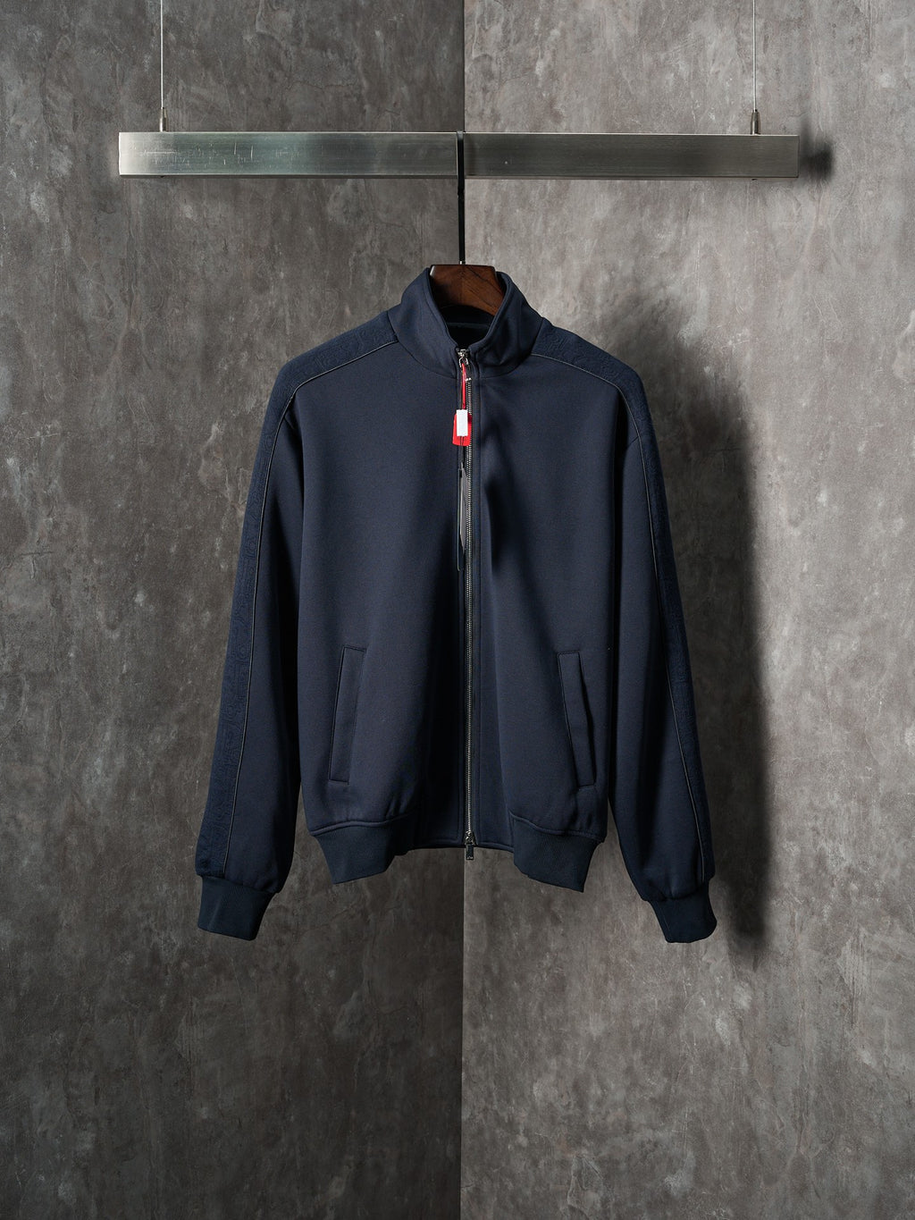 Navy zip-up jacket with stand collar and two front pockets