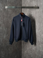 Navy zip-up jacket with stand collar and two front pockets