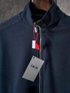 Navy jacket neckline with front zipper and stand collar detail