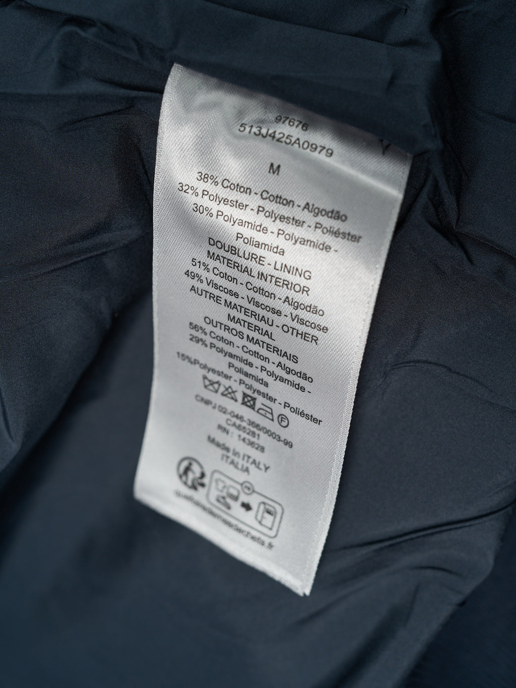 Jacket care label with size and fabric blend information