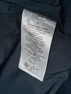 Jacket care label with size and fabric blend information