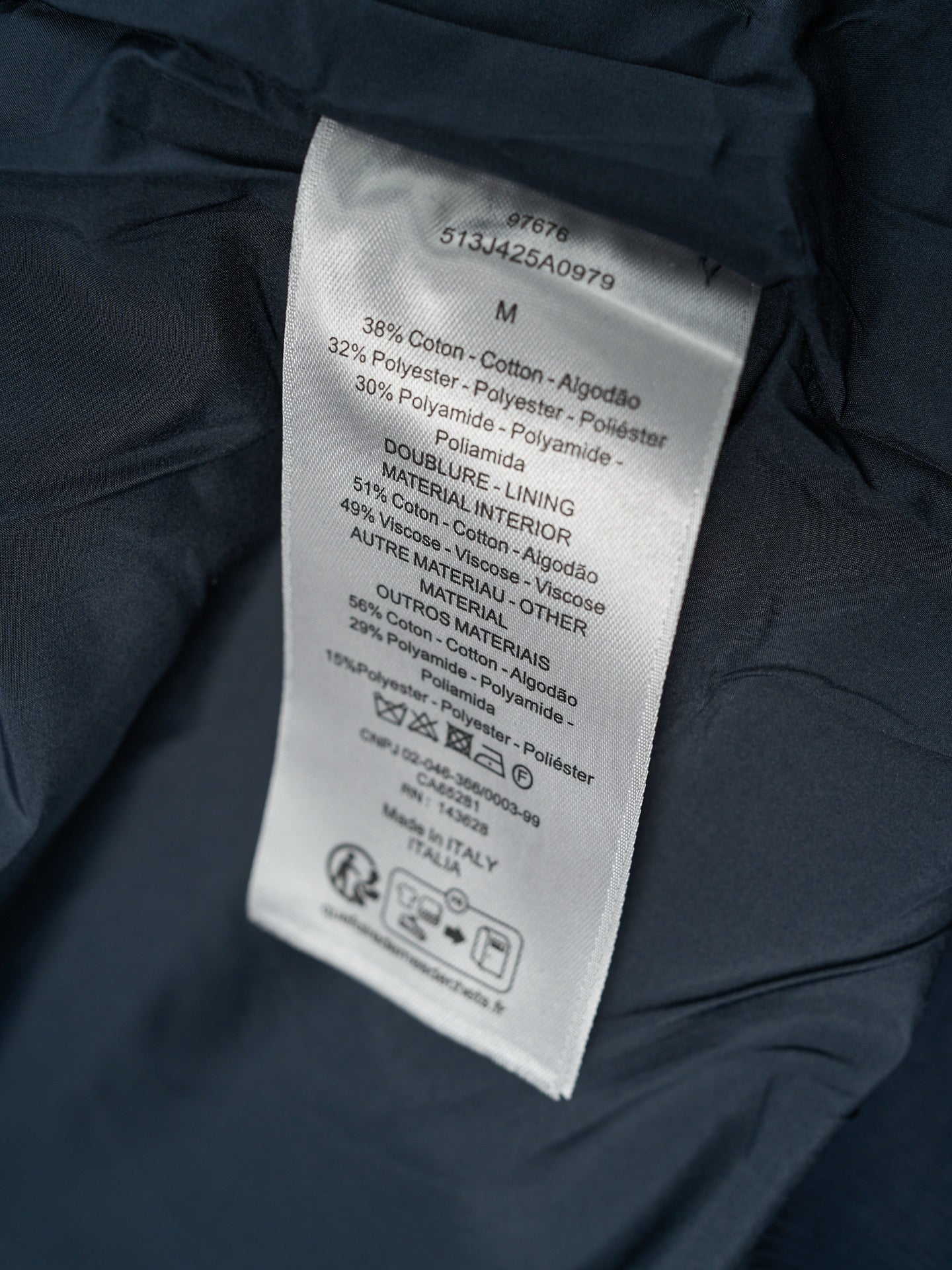Jacket care label with size and fabric blend information
