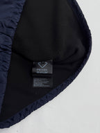Prada RE-NYLON label inside dark navy jacket hood