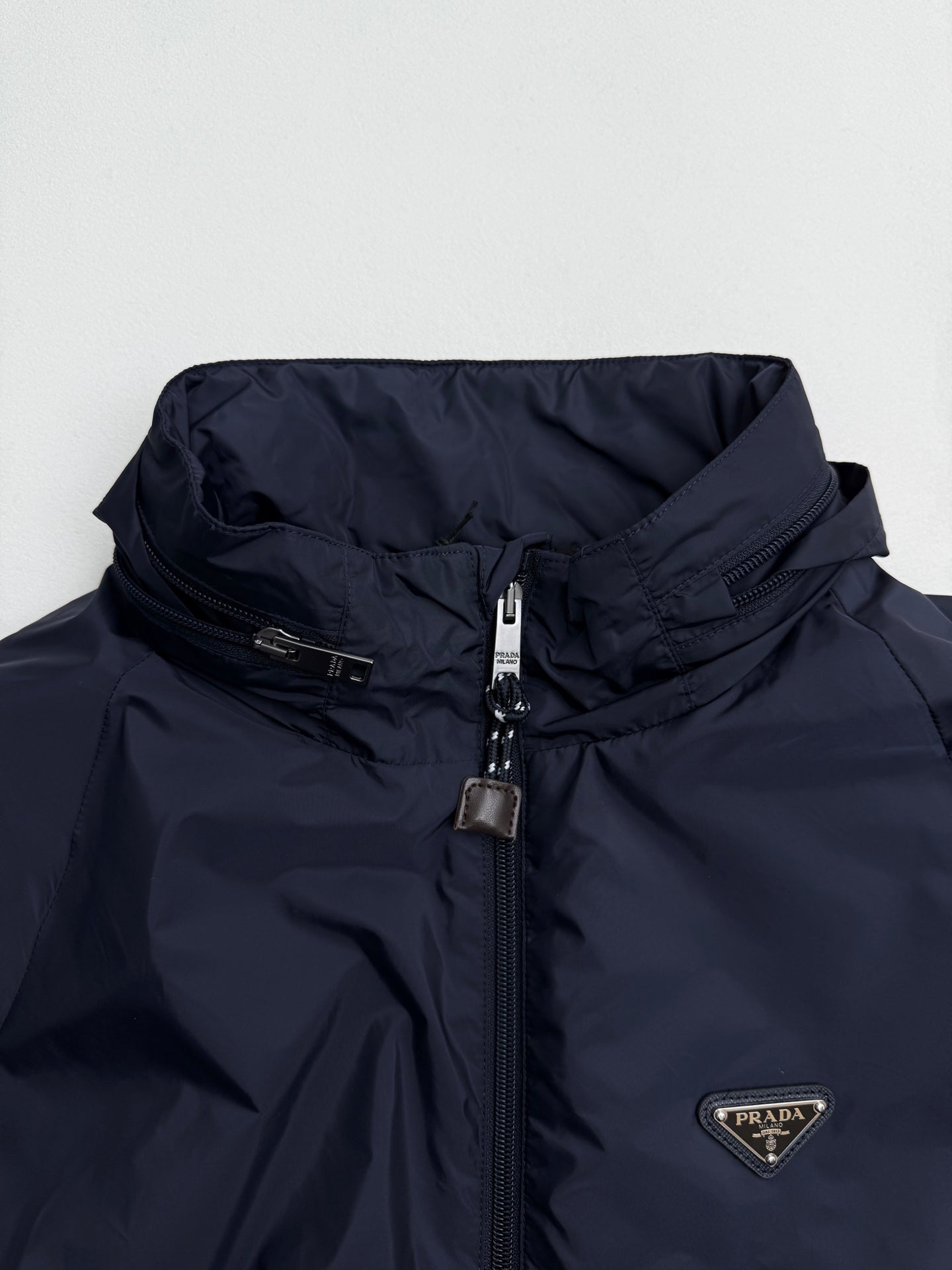 Prada dark navy hooded jacket, front zip and triangular logo patch