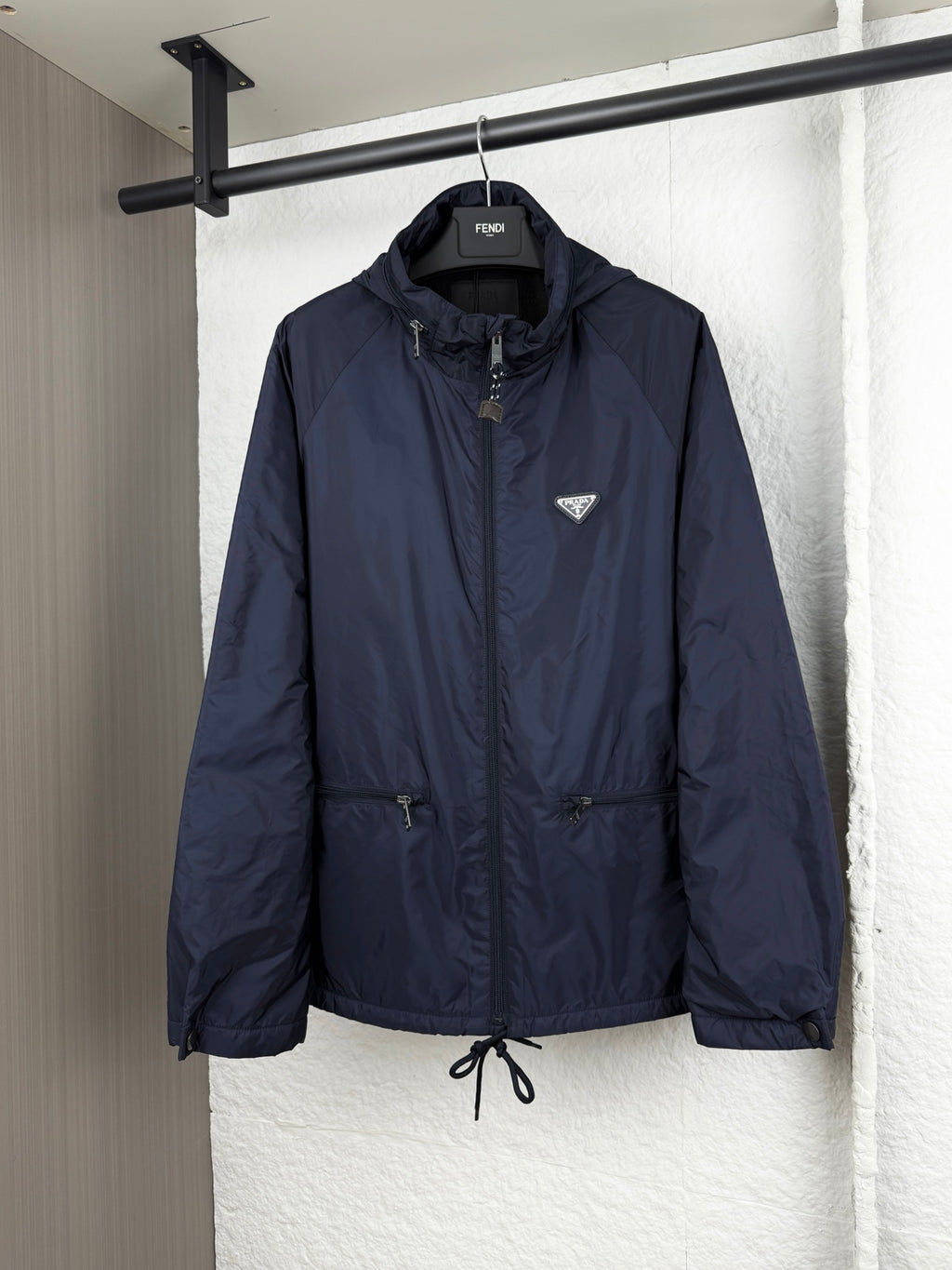 Prada dark navy long jacket with full-zip front and hood
