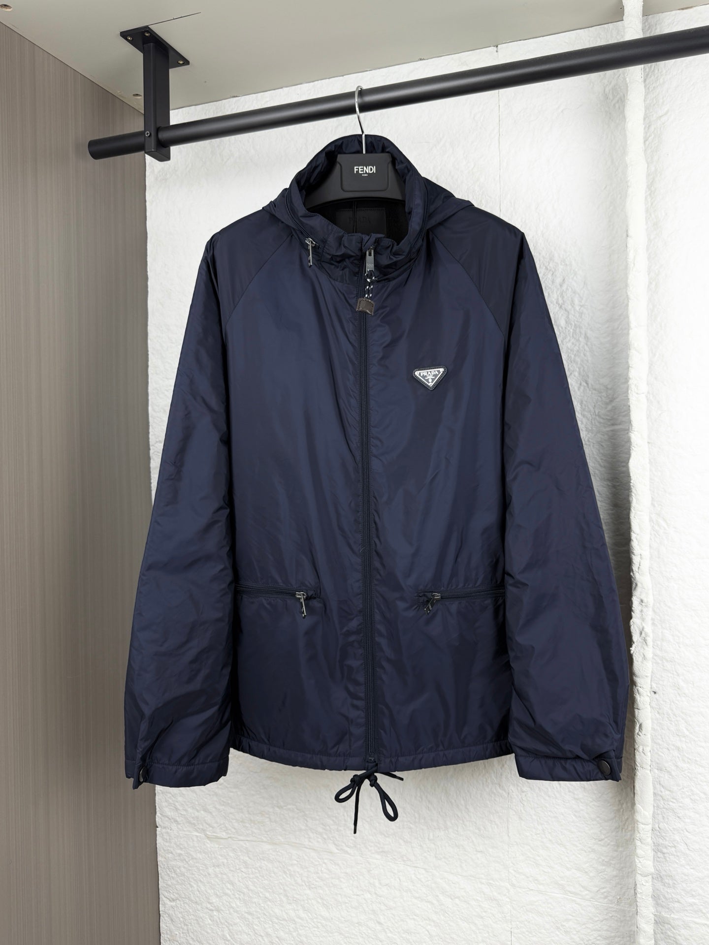 Prada dark navy long jacket with full-zip front and hood