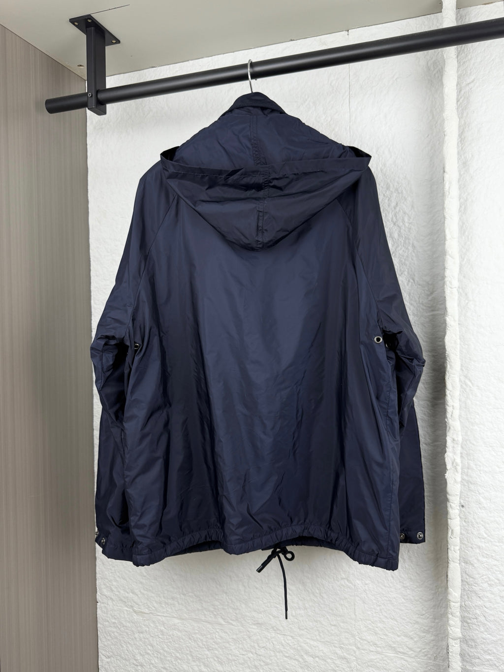 Prada dark navy long jacket with hood, drawstring hem, and zip pockets