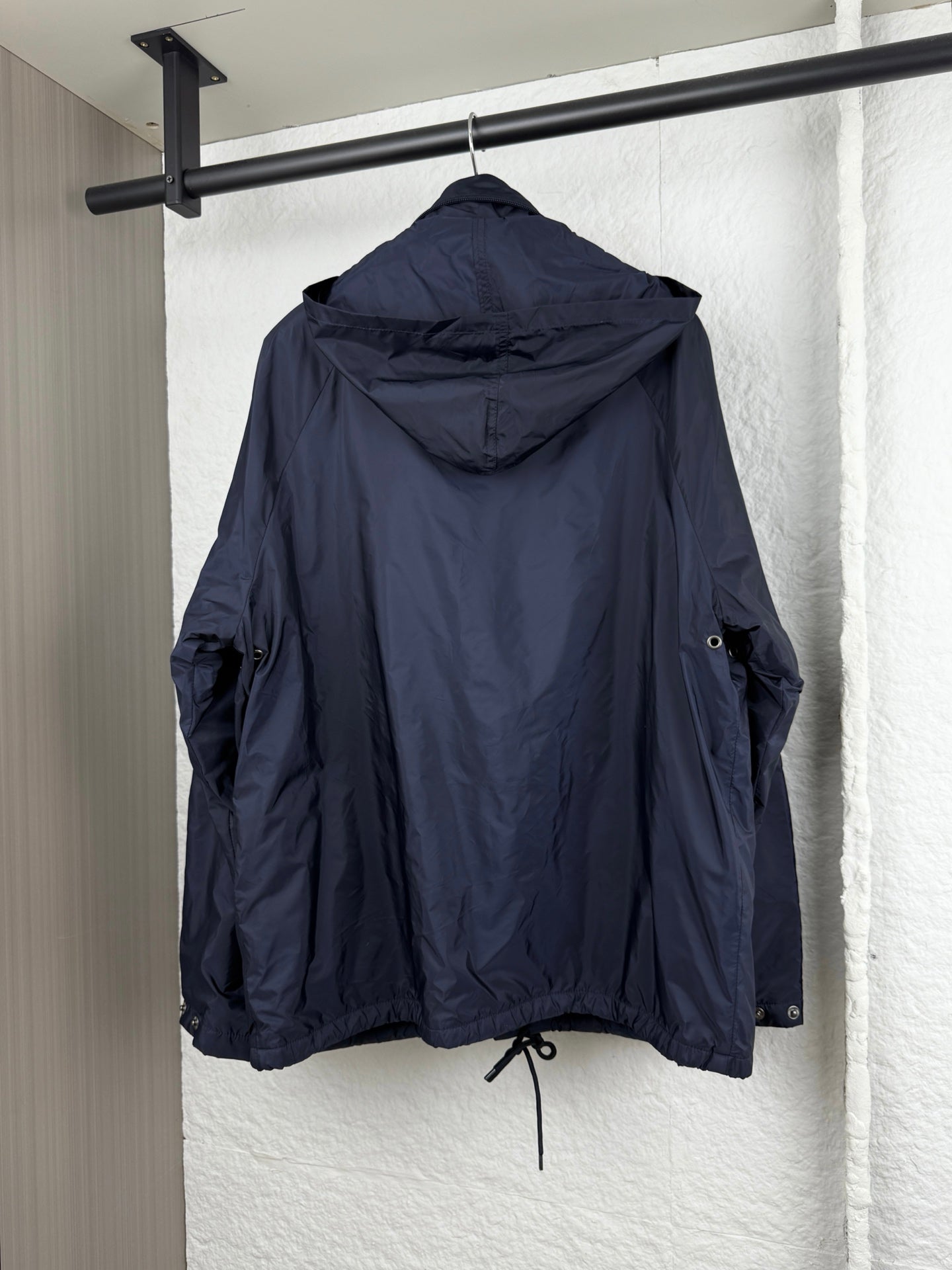 Prada dark navy long jacket with hood, drawstring hem, and zip pockets