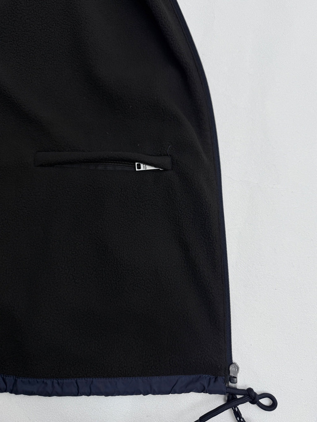 Prada dark navy jacket with side interior zipper pocket near hem