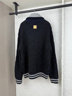 Louis Vuitton long knit cardigan, navy with gray-and-white striped hem and ribbed cuffs