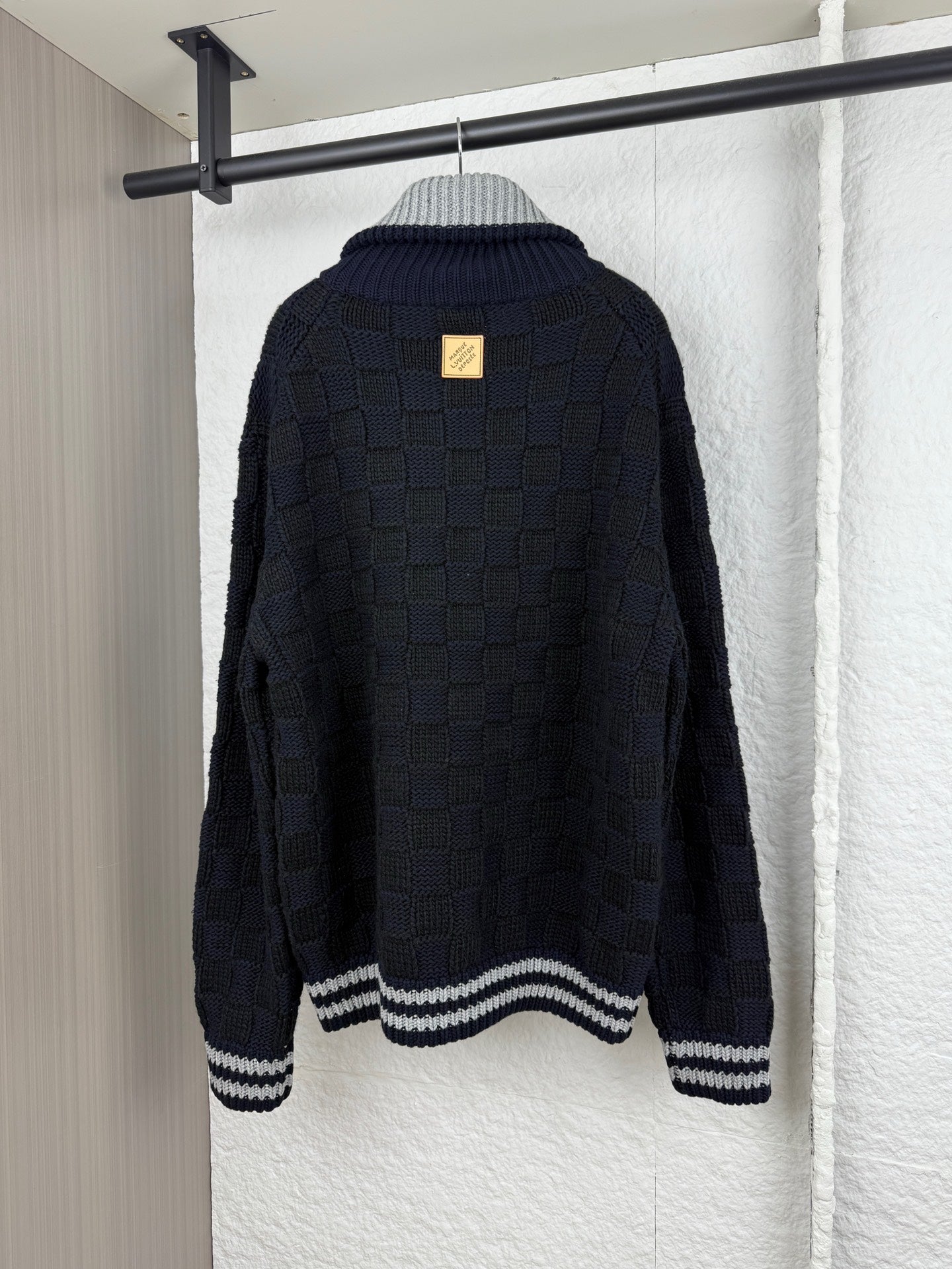 Louis Vuitton long knit cardigan, navy with gray-and-white striped hem and ribbed cuffs