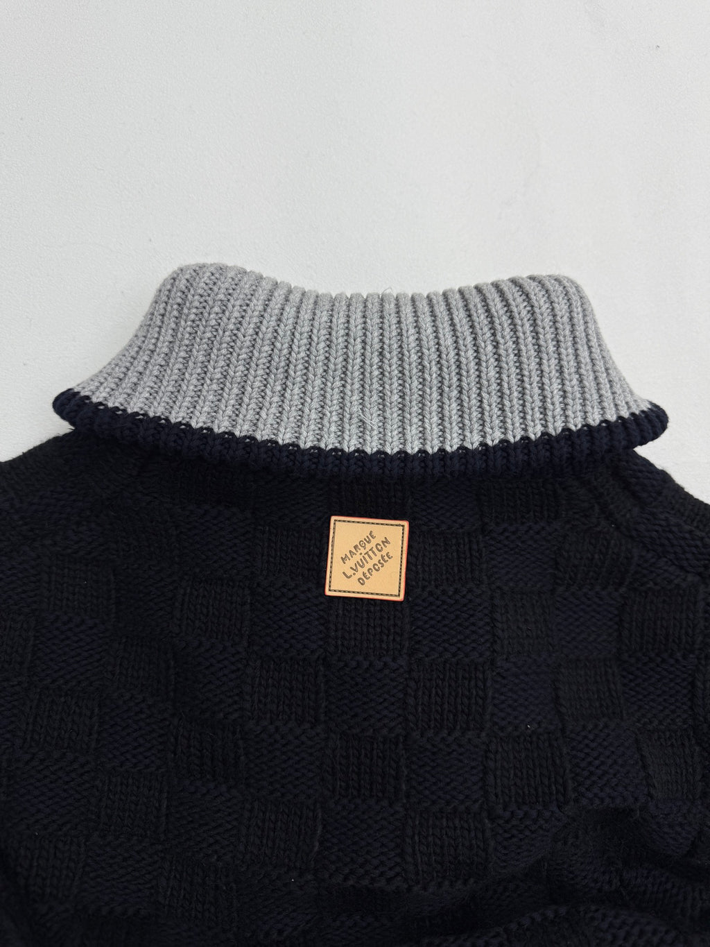 Louis Vuitton long knit cardigan back with tan logo patch and striped knit collar