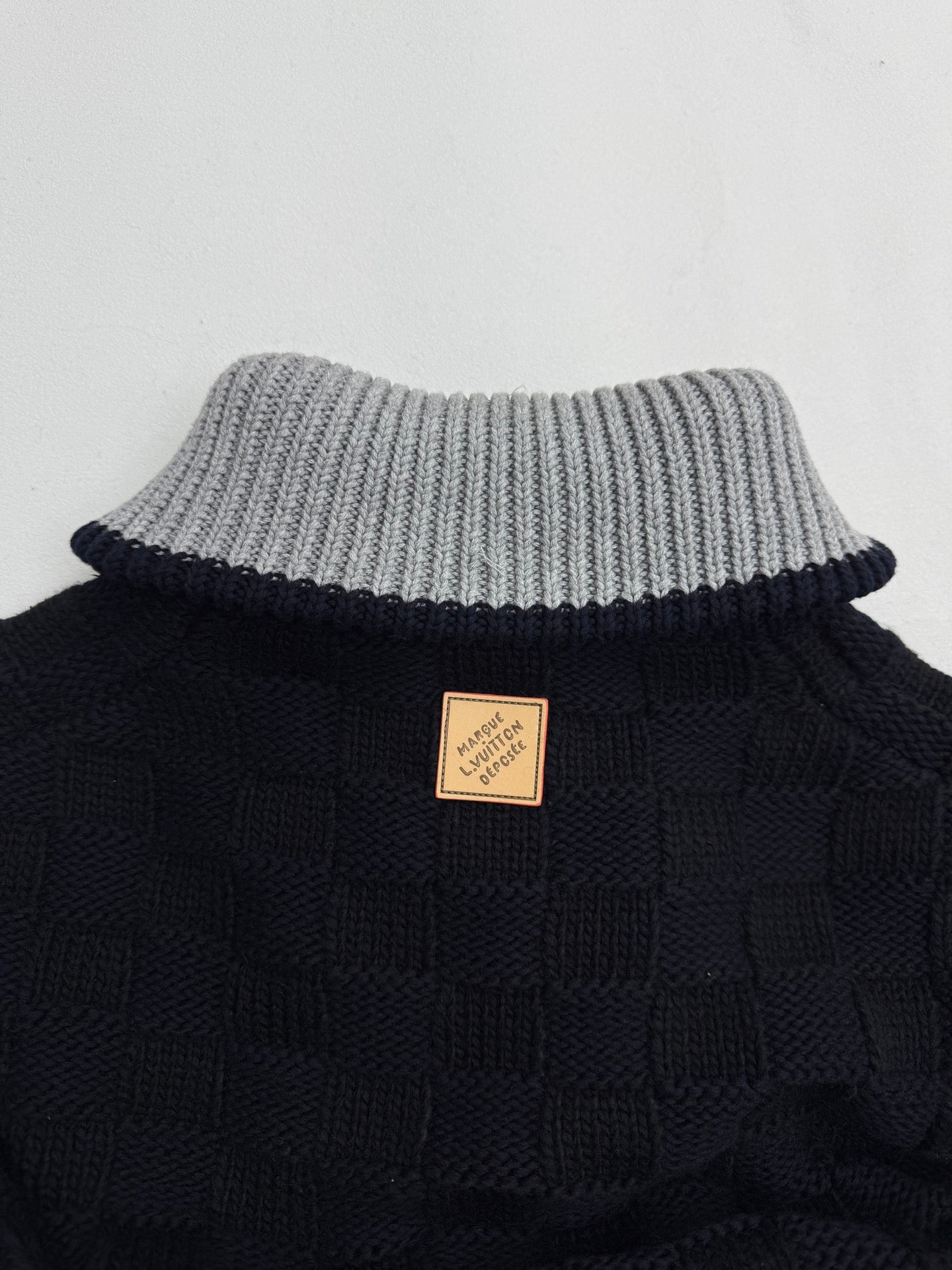 Louis Vuitton long knit cardigan back with tan logo patch and striped knit collar
