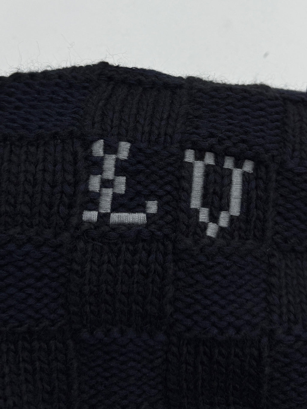 Louis Vuitton knit cardigan front with LV jacquard logo in dark navy