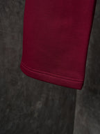 Maroon Gucci sweatpants with cuffed hem and neat stitched edge