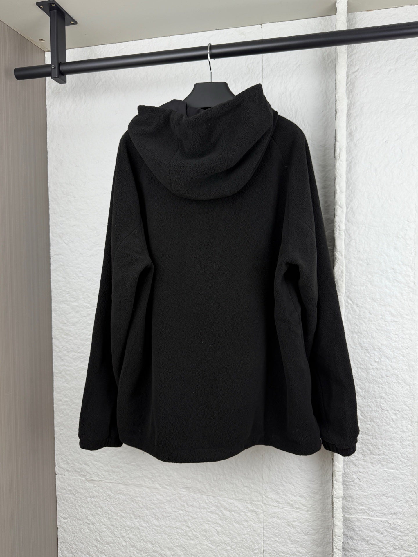Black hooded jacket with full back view and zip front
