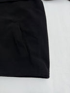 Black hooded jacket hem with seam detail
