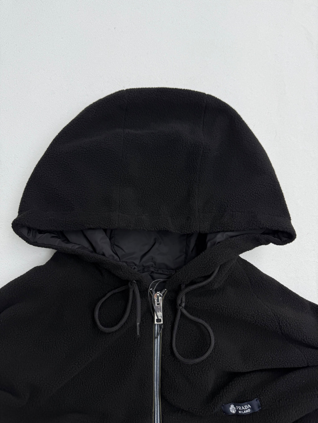 Black hooded jacket with drawstring and PRADA logo badge