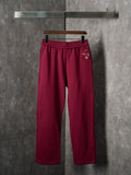Maroon Gucci sweatpants with elastic waistband and straight wide legs