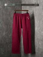 Maroon Gucci sweatpants with elastic waistband and straight wide legs