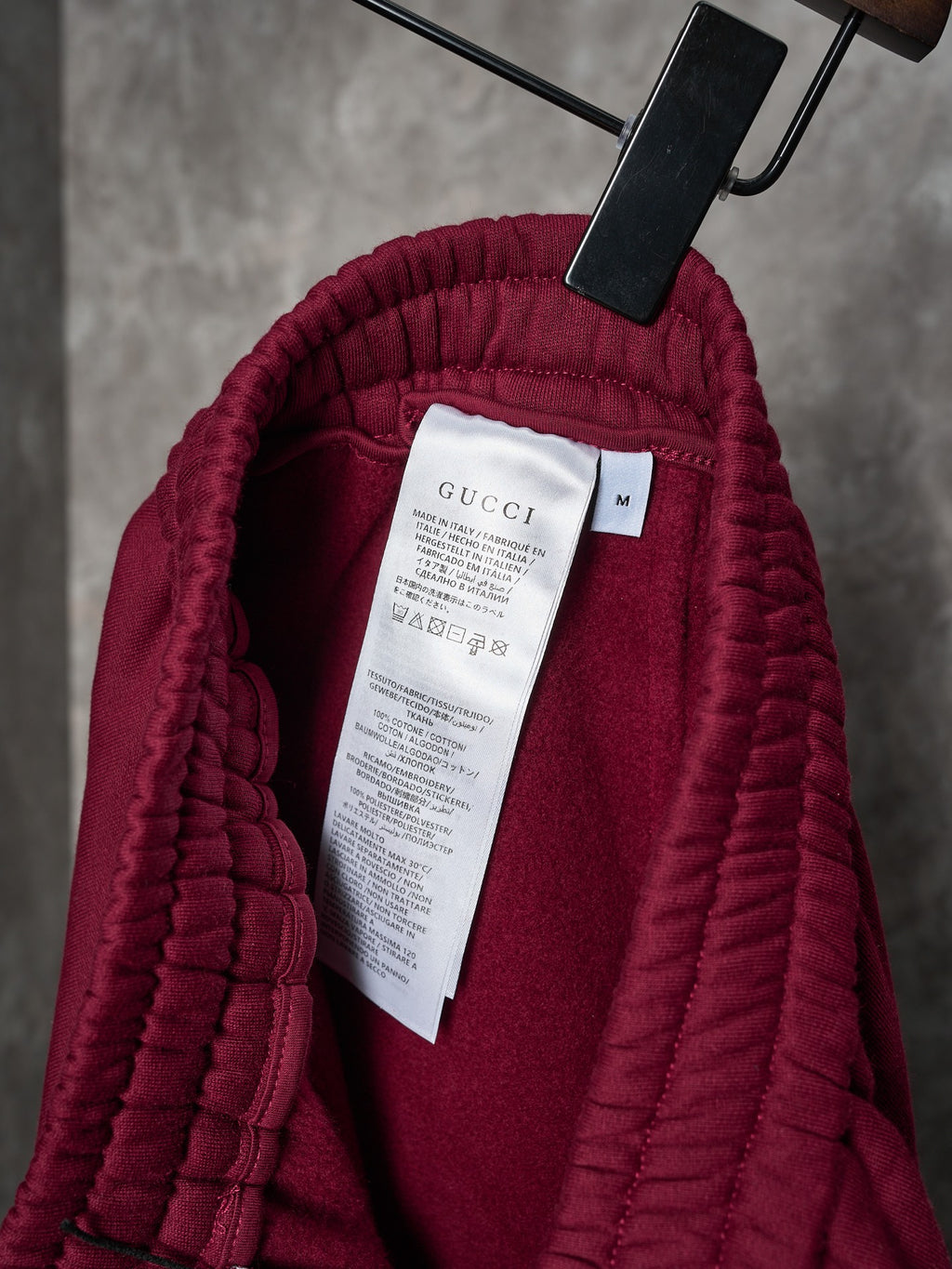 Maroon Gucci sweatpants with quilted inner lining and size/brand care label