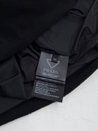 Black jacket interior label: PRADA RE-NYLON, size 48