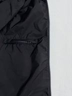 Black nylon jacket lining with zipper and seam stitching