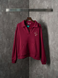 Burgundy long-sleeve polo sweatshirt with embroidered chest logo detail
