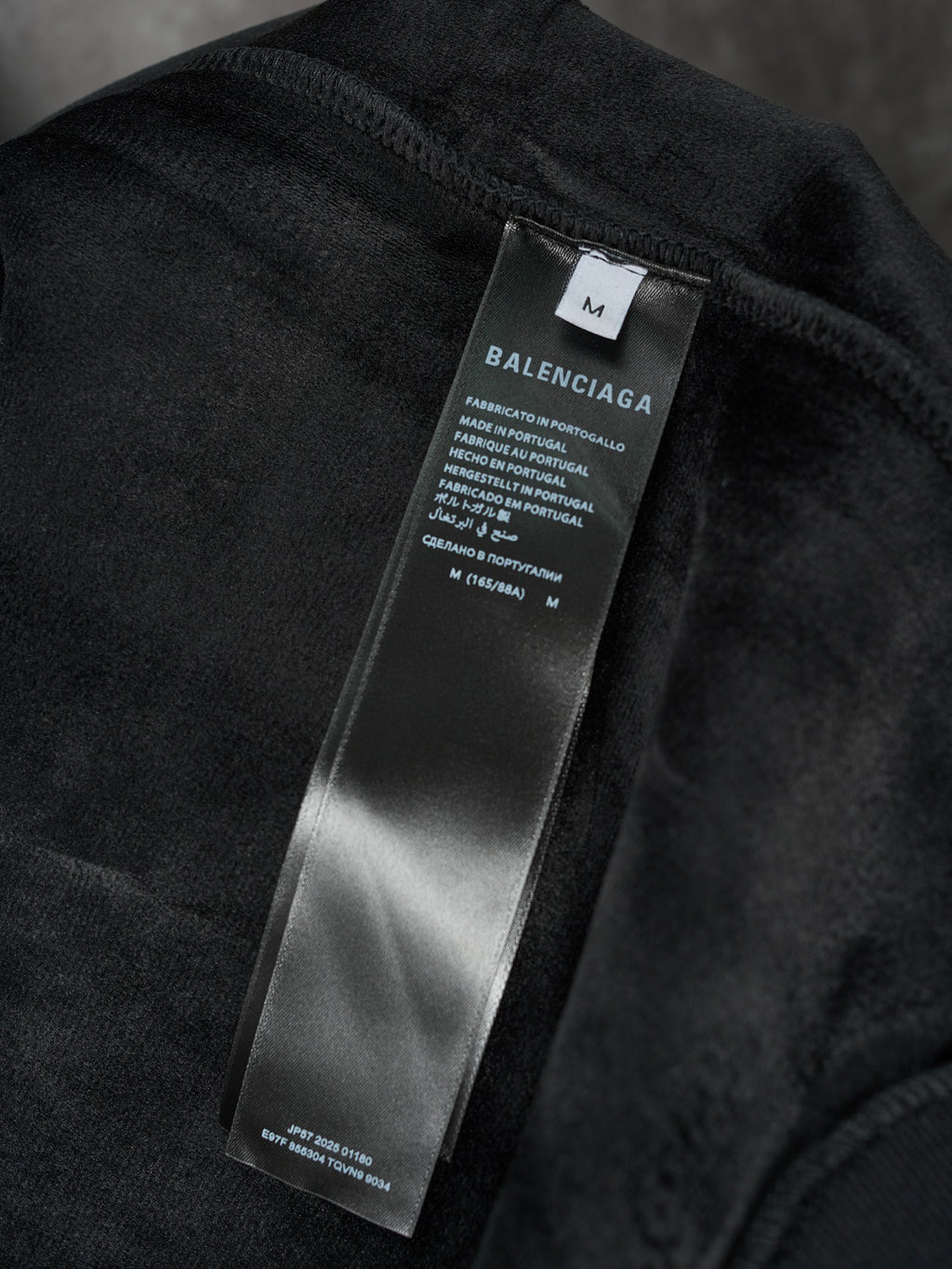 Black Balenciaga fabric care label on hoodie interior