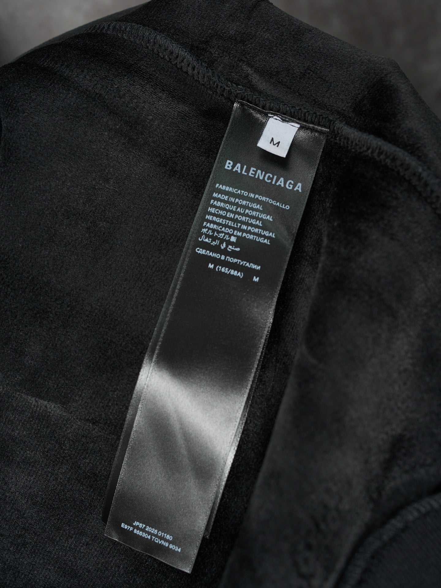 Black Balenciaga fabric care label on hoodie interior