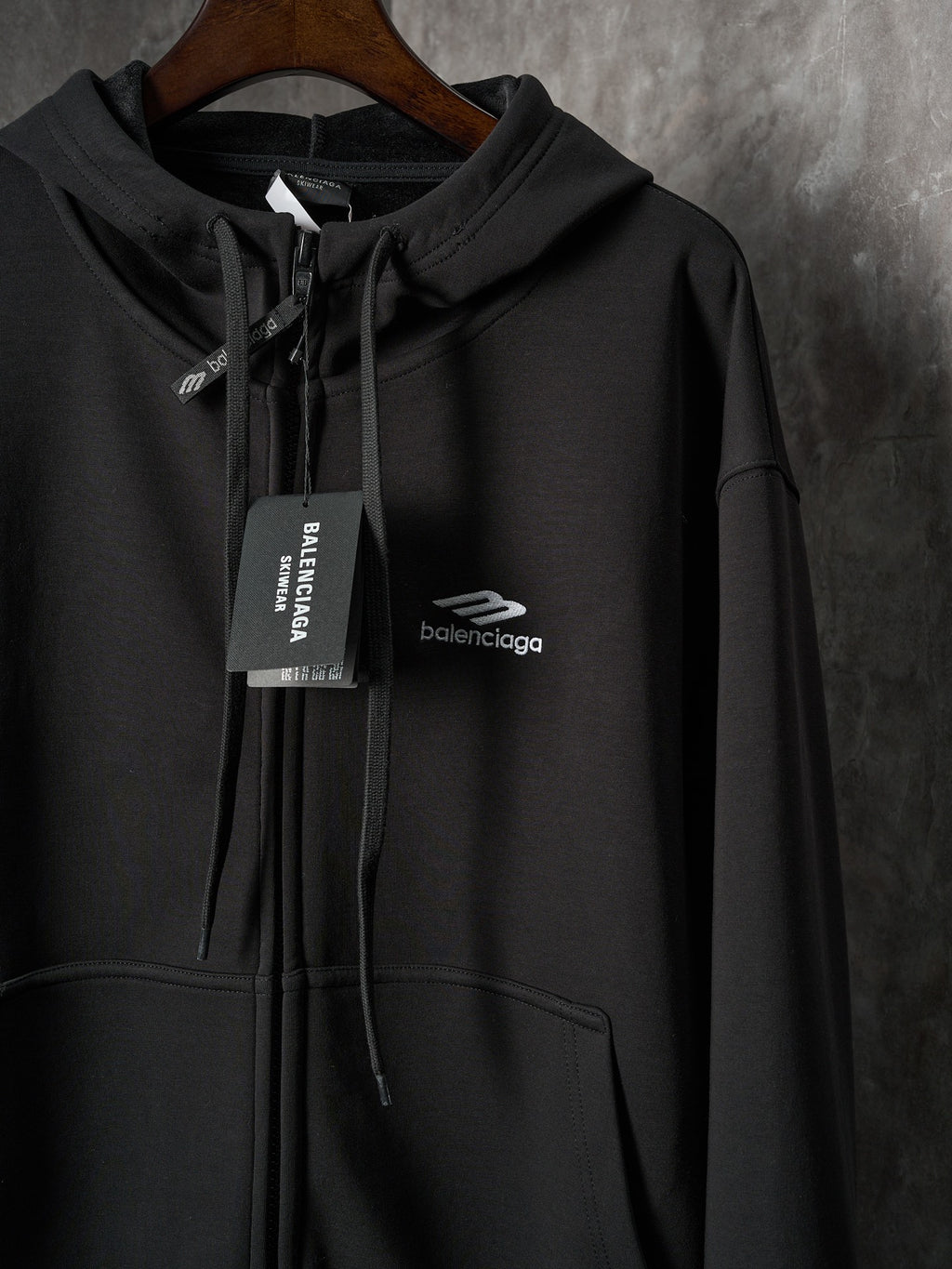 Black Balenciaga zip hoodie with hood and front pocket, chest logo