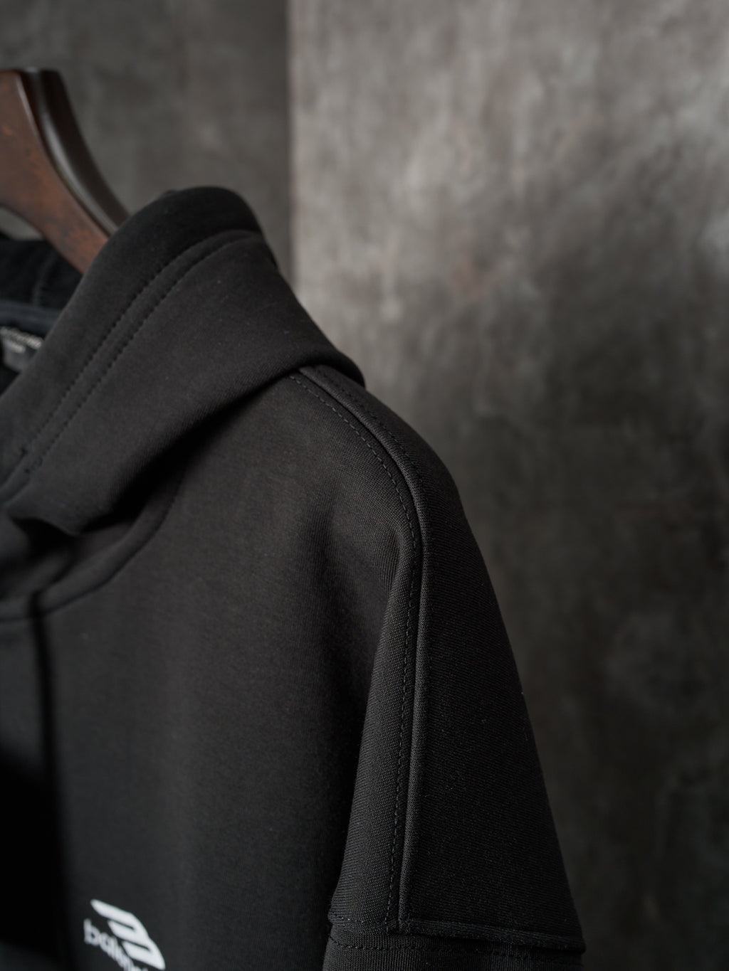 Black Balenciaga hoodie shoulder seam and hood edge detail