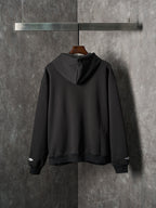 Black Balenciaga pullover hoodie with hood and ribbed cuffs, back view