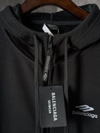 Black Balenciaga hoodie zipper pull with BALENCIAGA logo tag