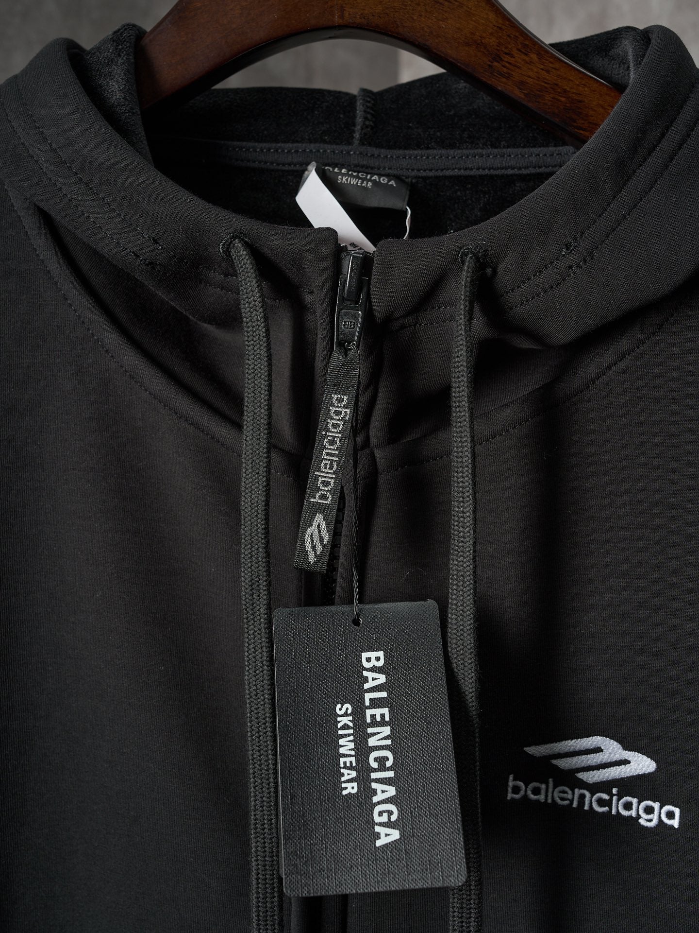 Black Balenciaga hoodie zipper pull with BALENCIAGA logo tag