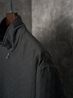 Long jacket shoulder and sleeve in dark GG pattern with zipper-trim pocket