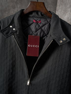 Long jacket front detail with dark stand collar, quilted lining, snap and zip pockets