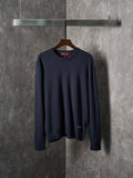 Navy knit long-sleeve sweater with ribbed crew neckline on a hanger