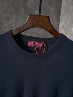 Dark navy crewneck sweater neckline with Gucci label inside collar